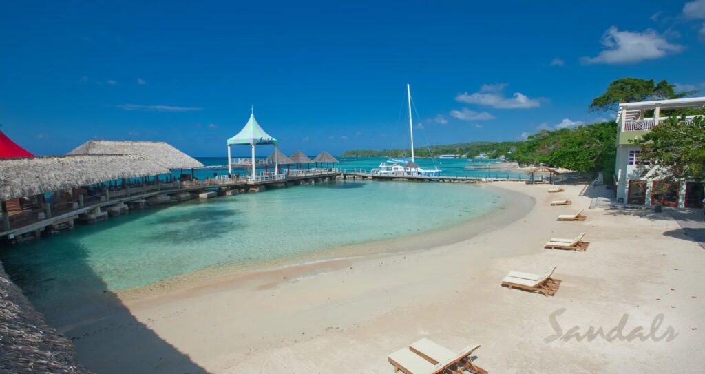 A beautiful view of the blue water beach of SANDALS OCHI, which is one of the best Sandals resort in Jamaica